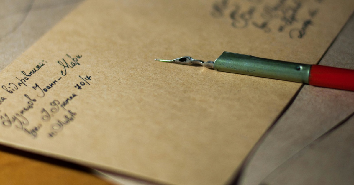 Envelope and fountain pen on a table